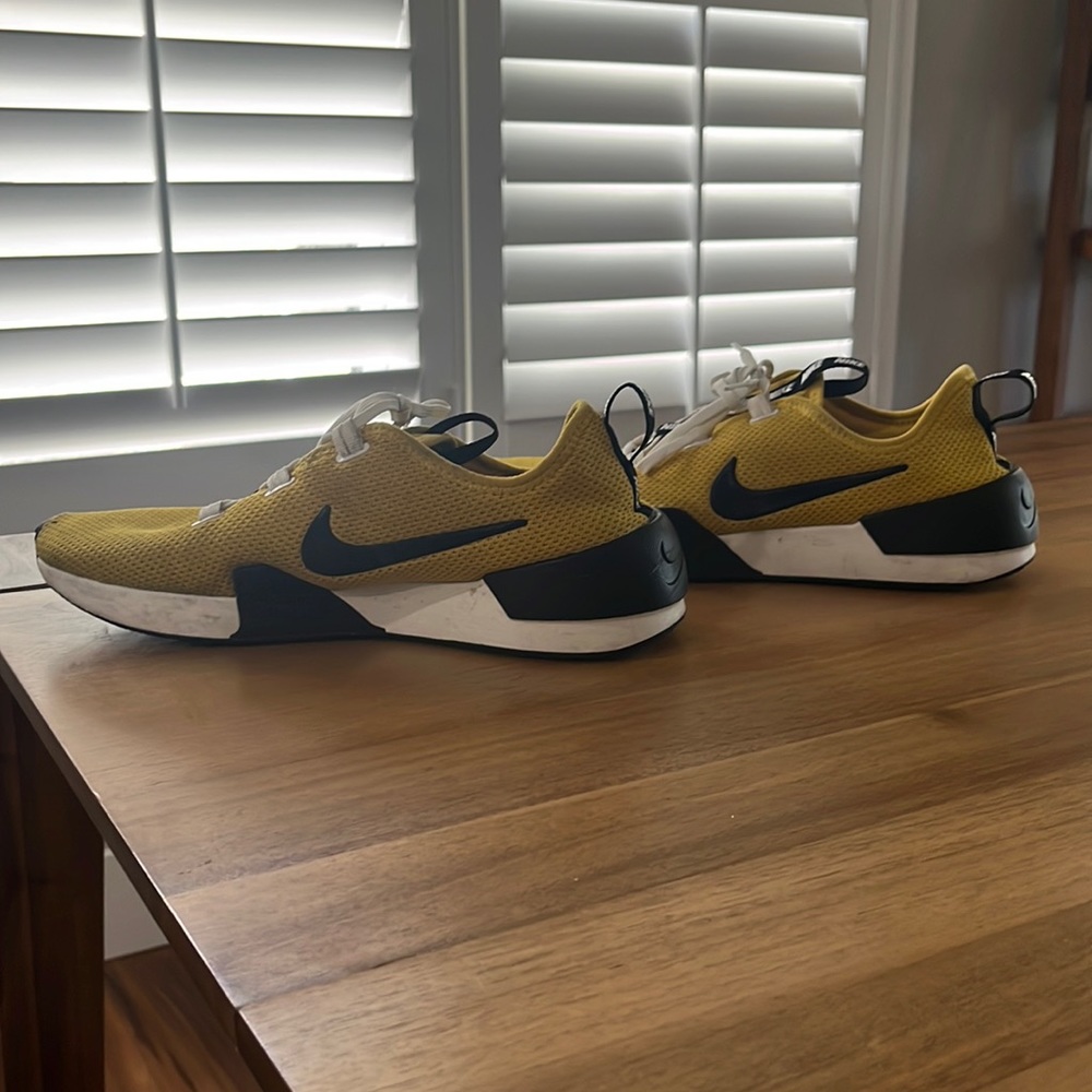 Gold /yellow and black Nike Tennis shoe